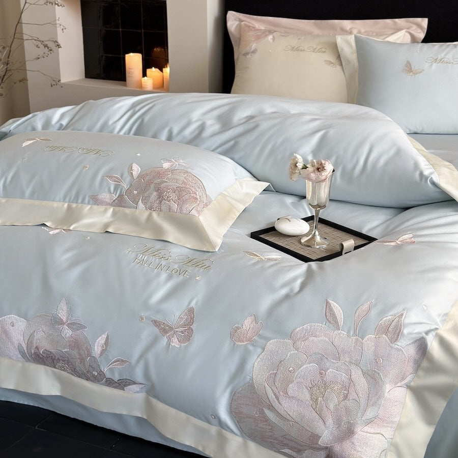 Luxurious satin bedding set with delicate rose and butterfly embroideries