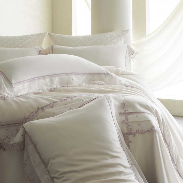 Satin bed linen set with delicate organza ruffle and lace trim