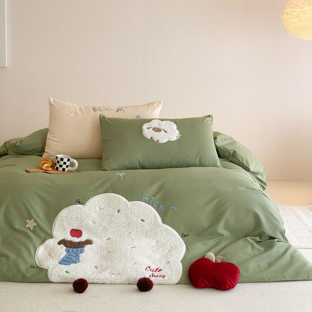 Children's bedding set with appliquéd duck figure, embroidered details, and extra soft microfiber cover