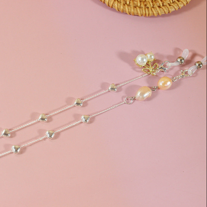 Elegant jewelry ribbon with pearls and silver accents Stornfield