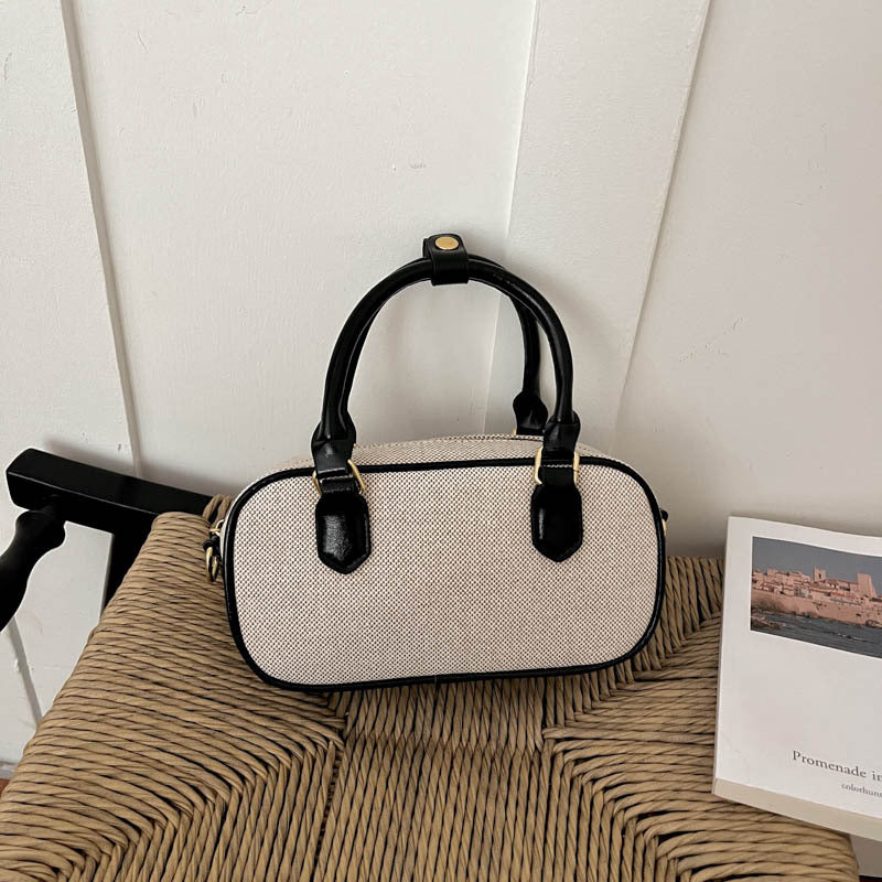 Vintage-Inspired Glossy Handheld Satchel