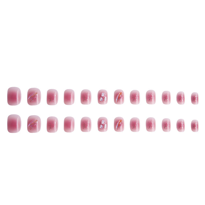 Artificial nails with delicate glitter design and floral accent Stornfield