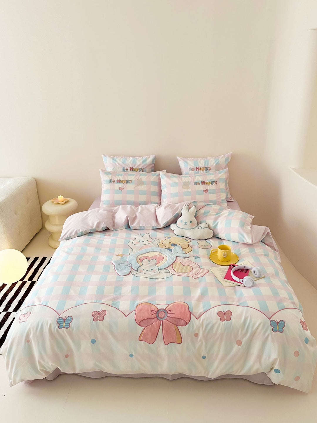 Playful cotton bedding set with embroidered bunny and cherry motif including decorative pillow
