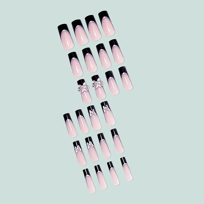 Glamorous artificial nails with rhinestone and butterfly elements Stornfield
