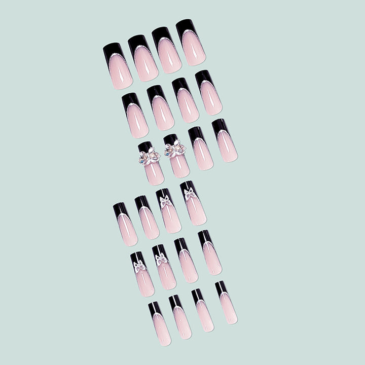 Glamorous artificial nails with rhinestone and butterfly elements Stornfield