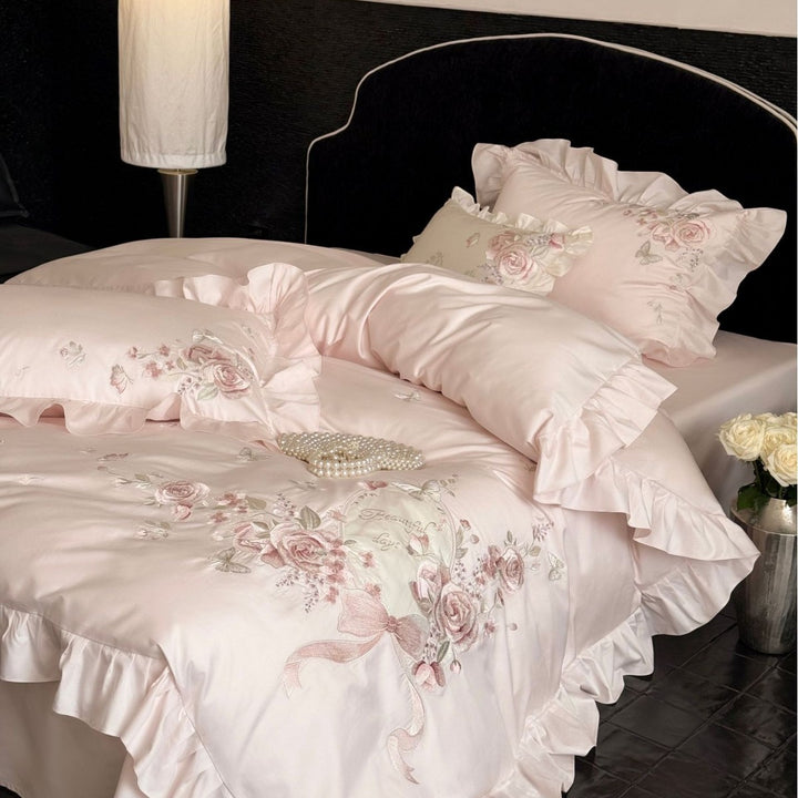 Romantic satin bed linen set with richly embroidered rose border and frill