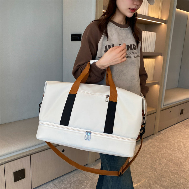 Sporty travel bag with sturdy carrying handles and adjustable shoulder strap Stornfield