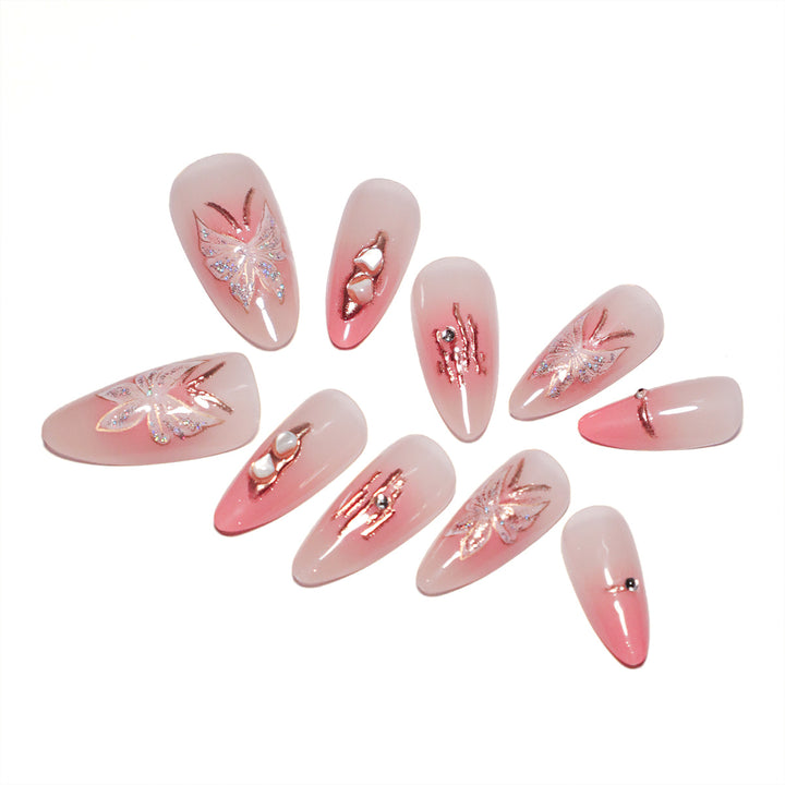 Artificial nail extensions with floral motifs and glitter accents Stornfield