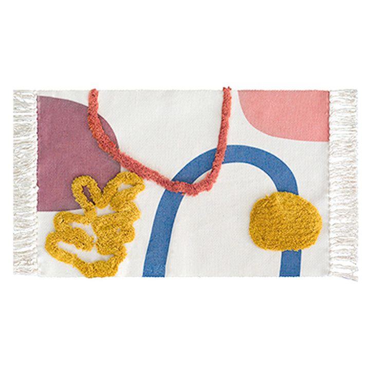 Hand-tufted bathroom mat with fringes, decorative dot-and-dash pattern and non-slip backing Stornfield
