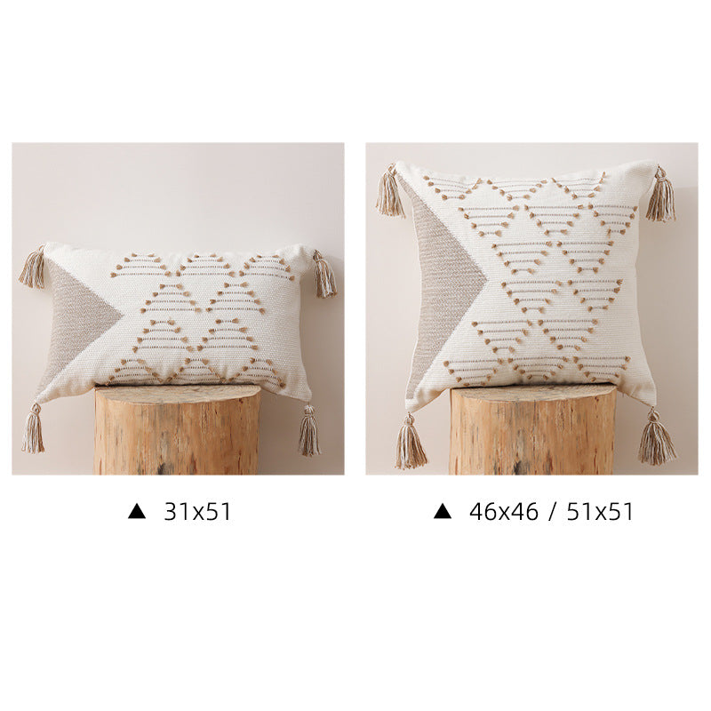 Decorative woven cushion cover with geometric tuft-relief and tassels Stornfield