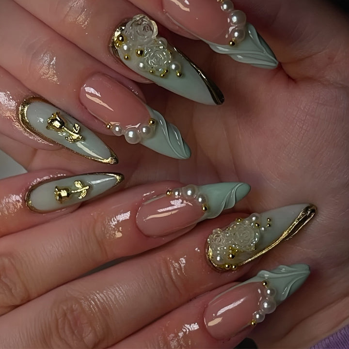 Luxurious Stiletto Nail Enhancements with Floral Accents Stornfield
