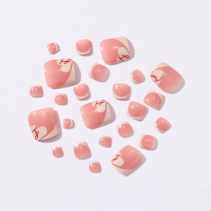 Artificial nail set with elegant French tips and romantic heart designs Stornfield