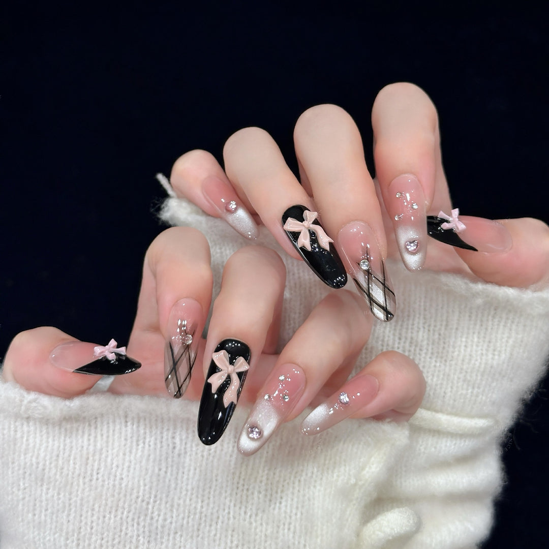 Artificial nail tips with elegant bows and glitter details Stornfield