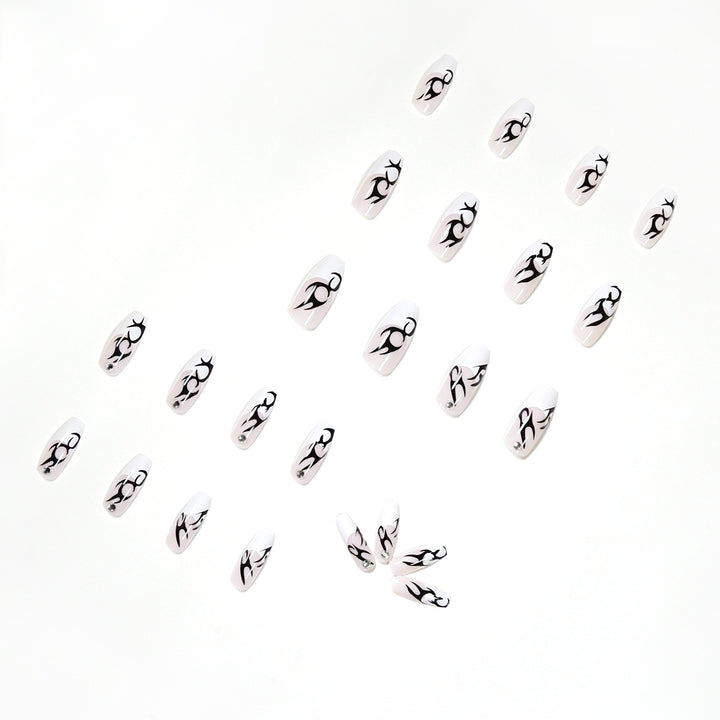 Elegant Artificial Nails with Decorative Black and Glitter Accents Stornfield