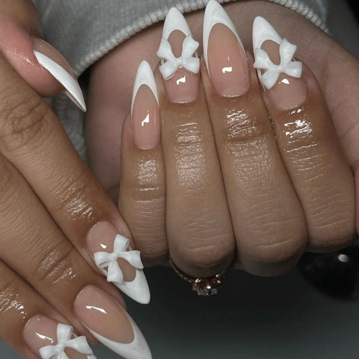 Artificial nail set with elegant tips and delicate bow decorations Stornfield