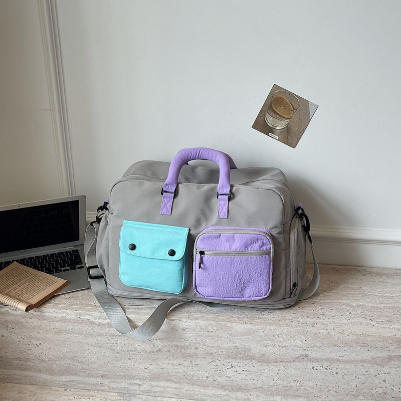 Sporty travel bag with multifunctional outer pockets Stornfield