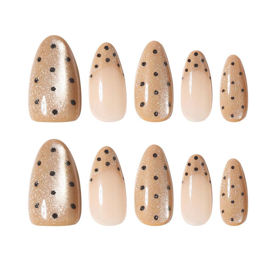 Elegant stiletto nails with glitter and dot design Stornfield