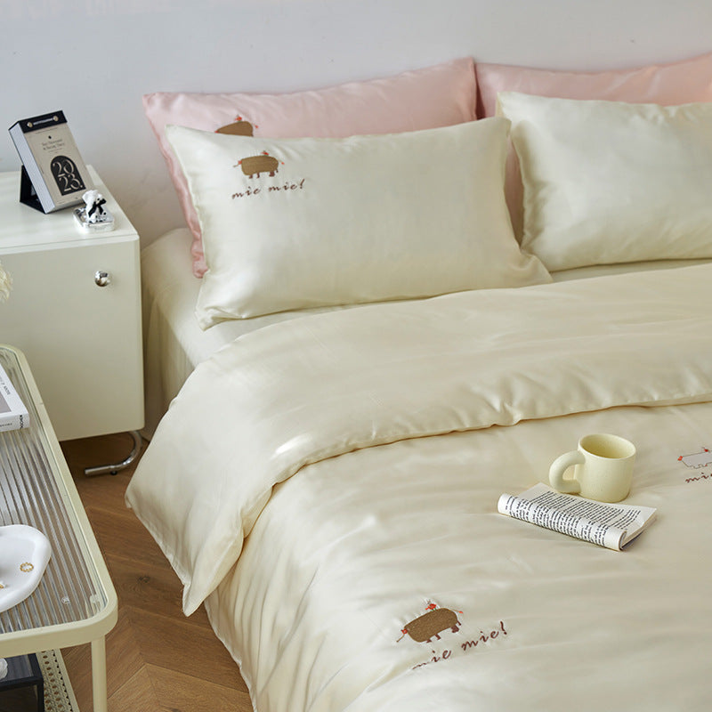 Reversible bedding set made of cotton percale with finely embroidered breakfast motifs
