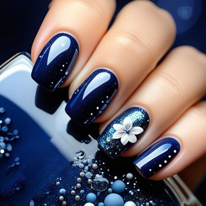 Artificial nails in elegant glitter design with floral embellishments Stornfield