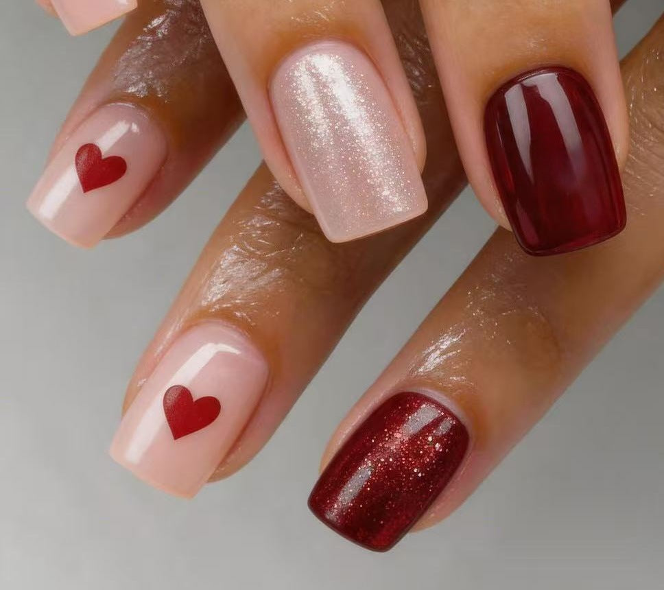 Art nail set with heart designs and glitter Stornfield