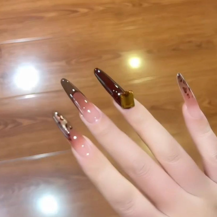 Artificial nails with elegant glitter and gold accent design Stornfield