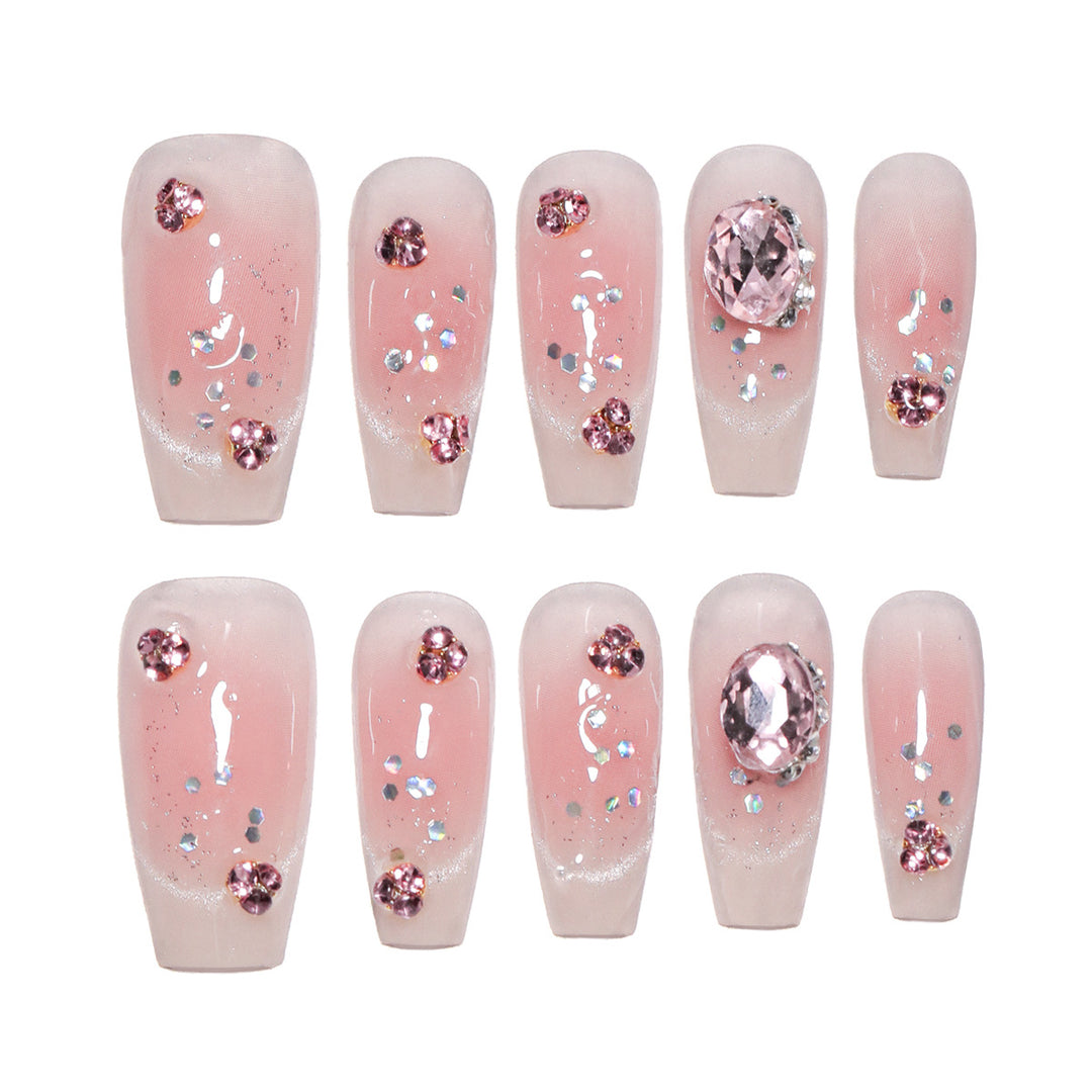 Artificial nail extensions with artistic glitter accents Stornfield