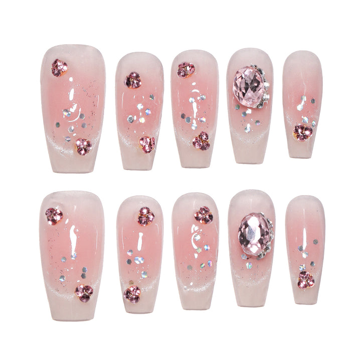 Artificial nail extensions with artistic glitter accents Stornfield