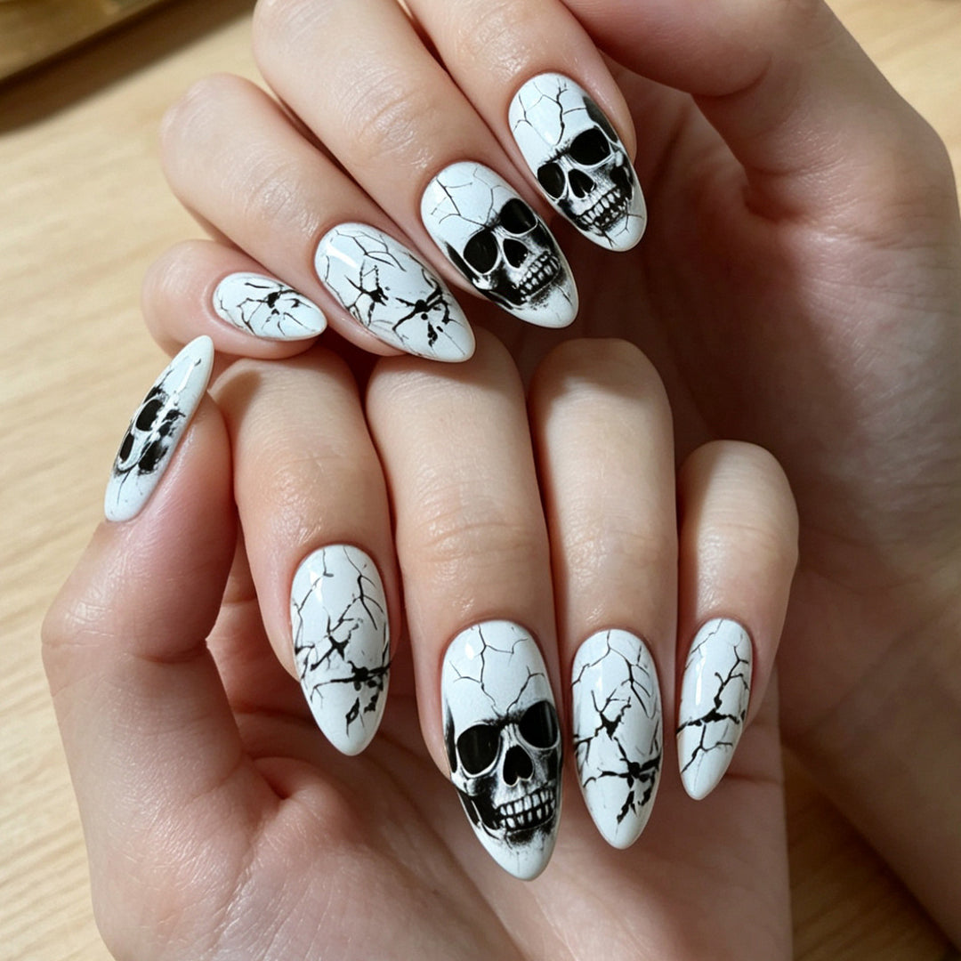 Artificial nails with playful skull design and crackle effects Stornfield