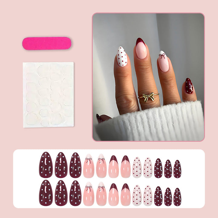 Artificial nail set with elegant bow and dot motifs Stornfield