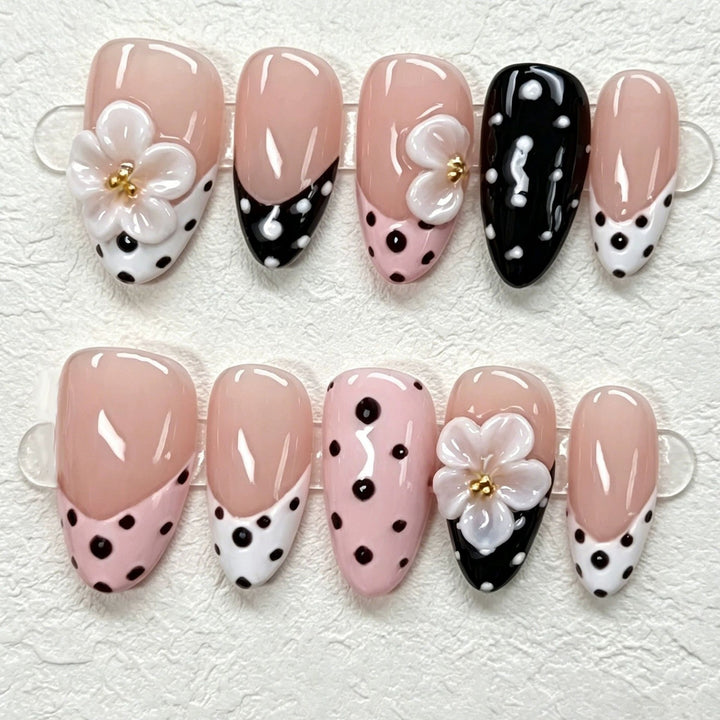 Artistic Press-On Nail Set Featuring Floral and Polka Dot Designs