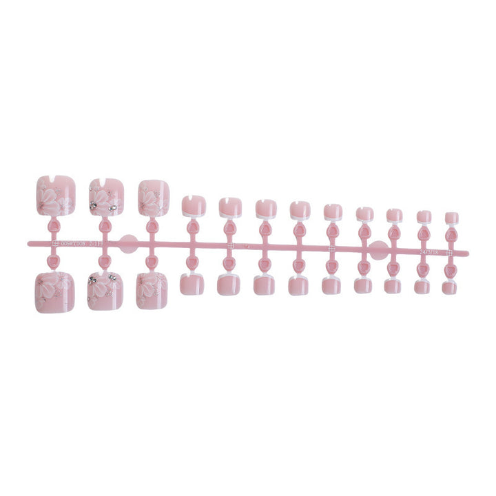 Nail art set with delicate floral design and glitter accents Stornfield