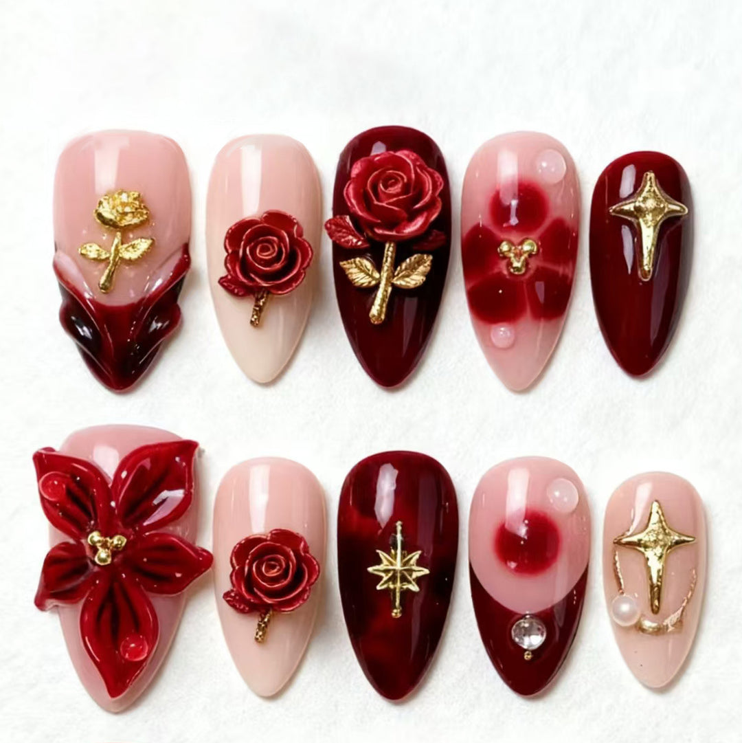 Artificial nail set with elegant floral applications and glamorous accents Stornfield