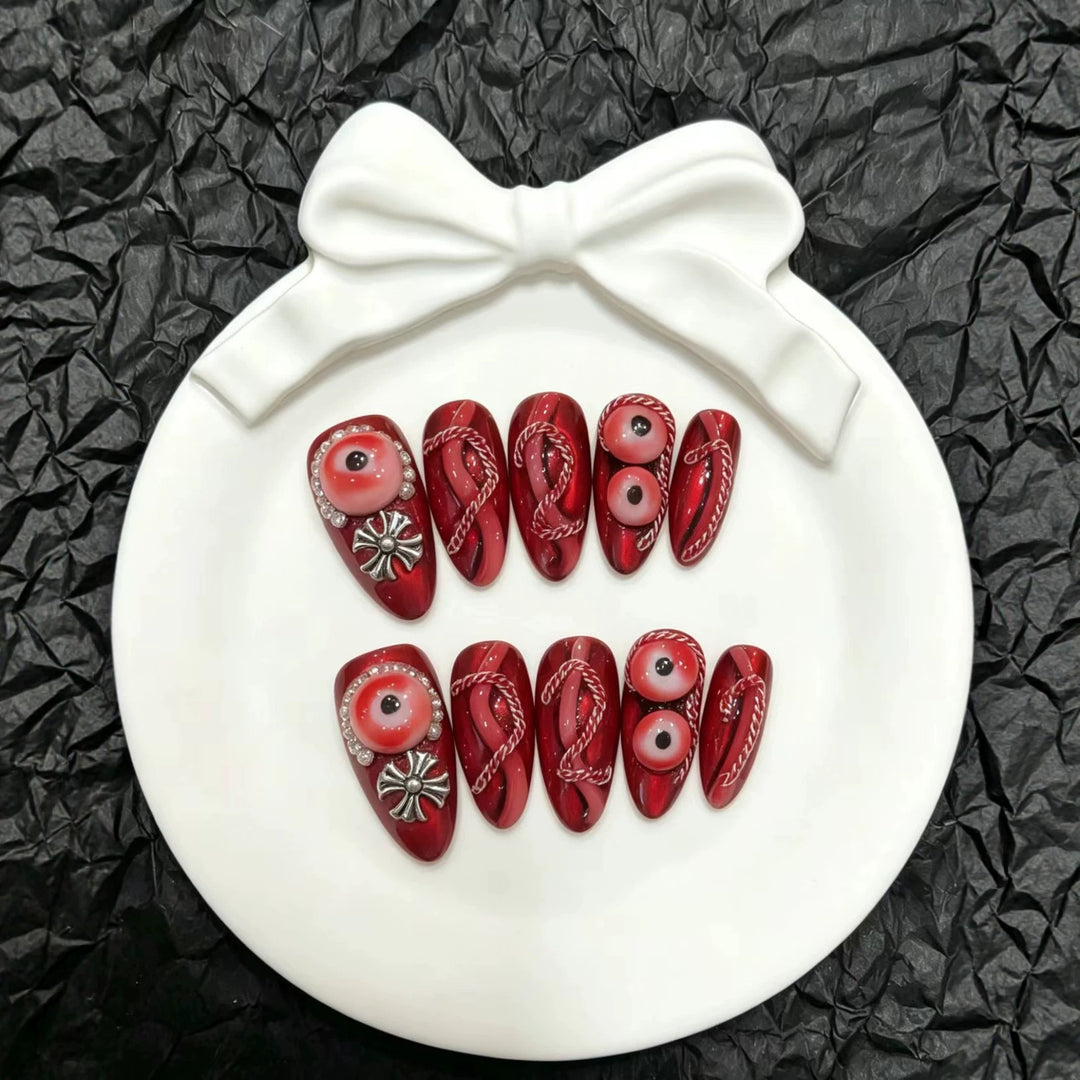 Artistic Press-On Nail Art Set with Unique Red Designs