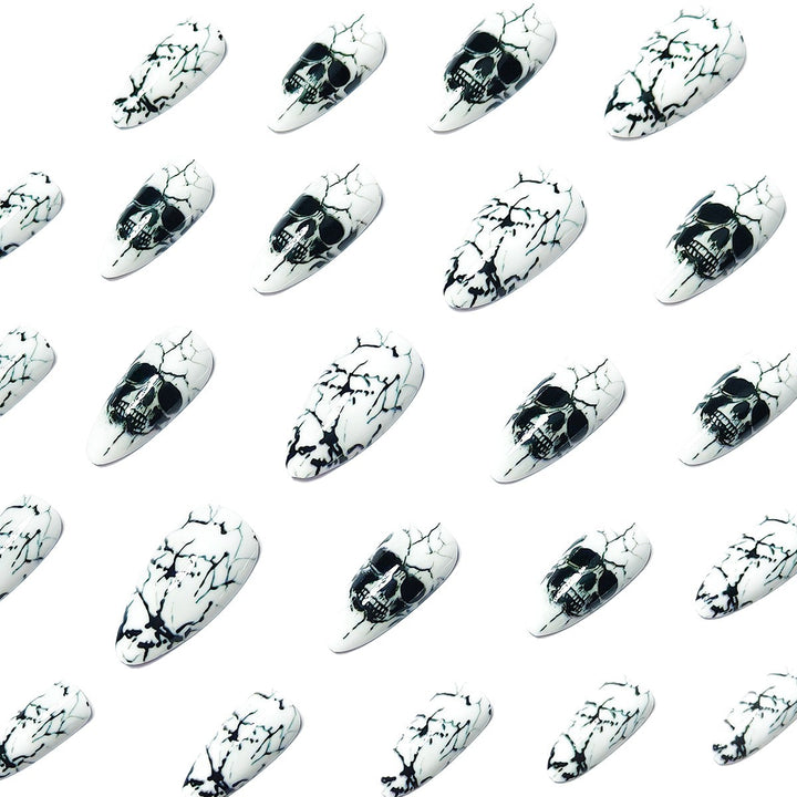 Artificial nails with playful skull design and crackle effects Stornfield
