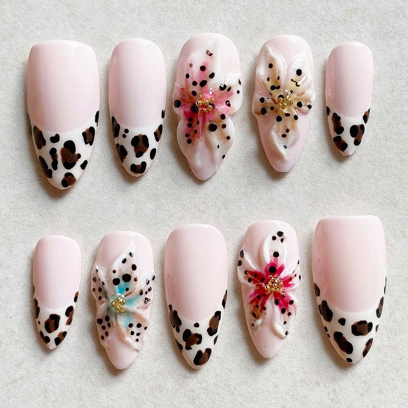 Artificial nail set with exquisite floral design and creative glitter accents Stornfield