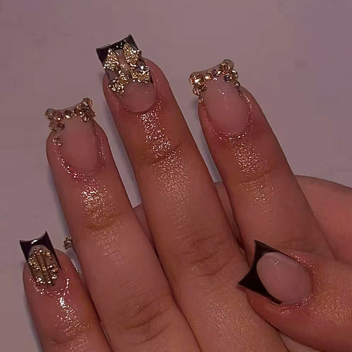 Artificial nail set with elegant golden decorations and modern design Stornfield