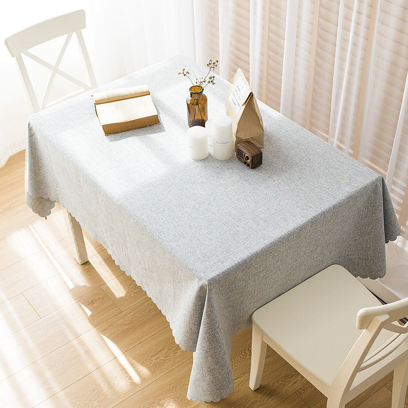 Rectangular tablecloth in linen look with wavy arc edge