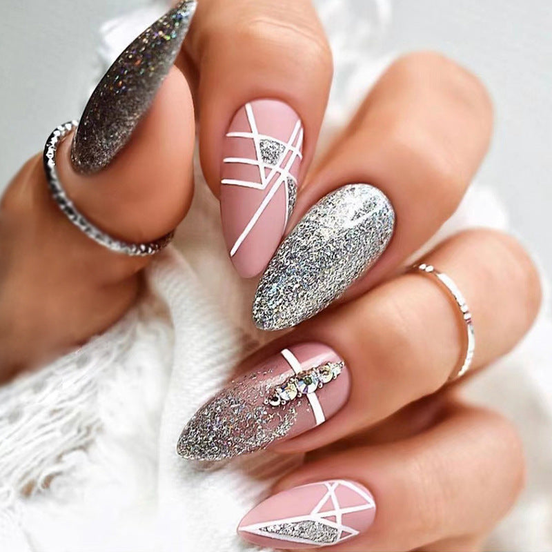 Artful nail extensions with glitter and geometric designs Stornfield