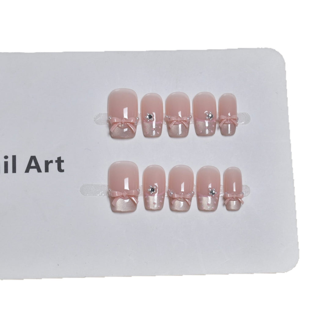 Elegant French Tip Press-On Nail Art with Bow Accents Stornfield