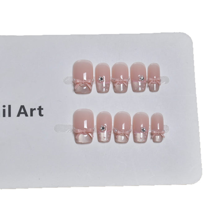 Elegant French Tip Press-On Nail Art with Bow Accents Stornfield