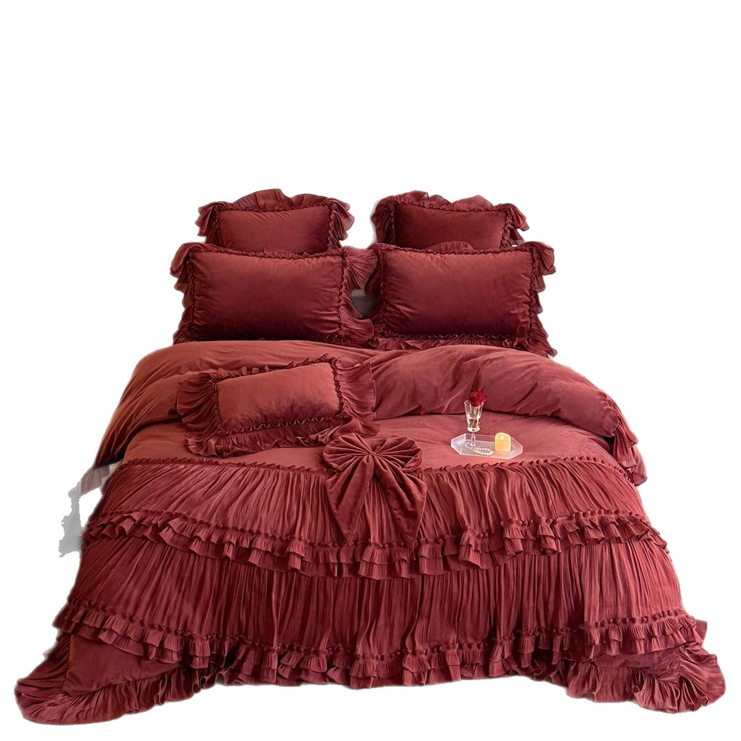Romantic ruffled velvet bed set with pleated frills and decorative cushions