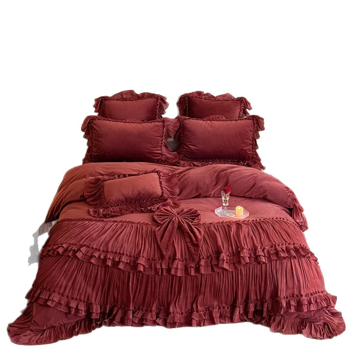 Romantic ruffled velvet bed set with pleated frills and decorative cushions