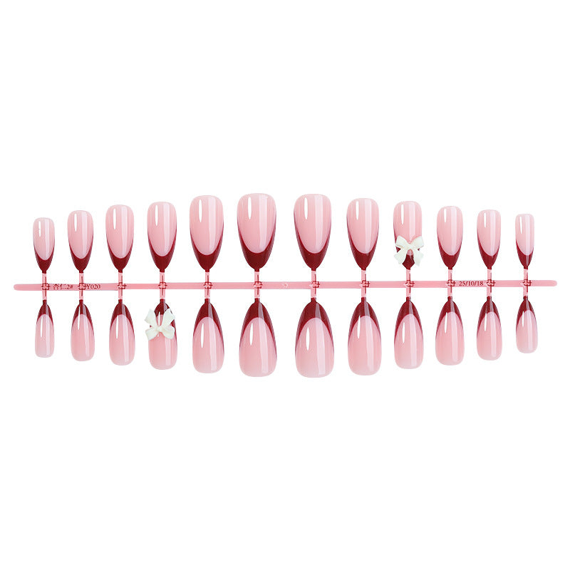 Acrylic nail set with creative French tip design and cute bows Stornfield
