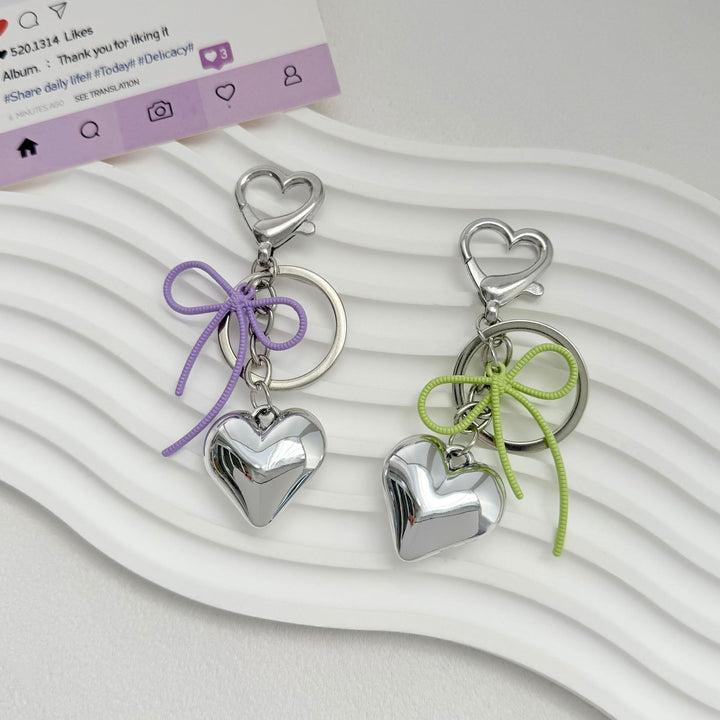 Heart-Shaped Metallic Keychain with Decorative Bow Stornfield