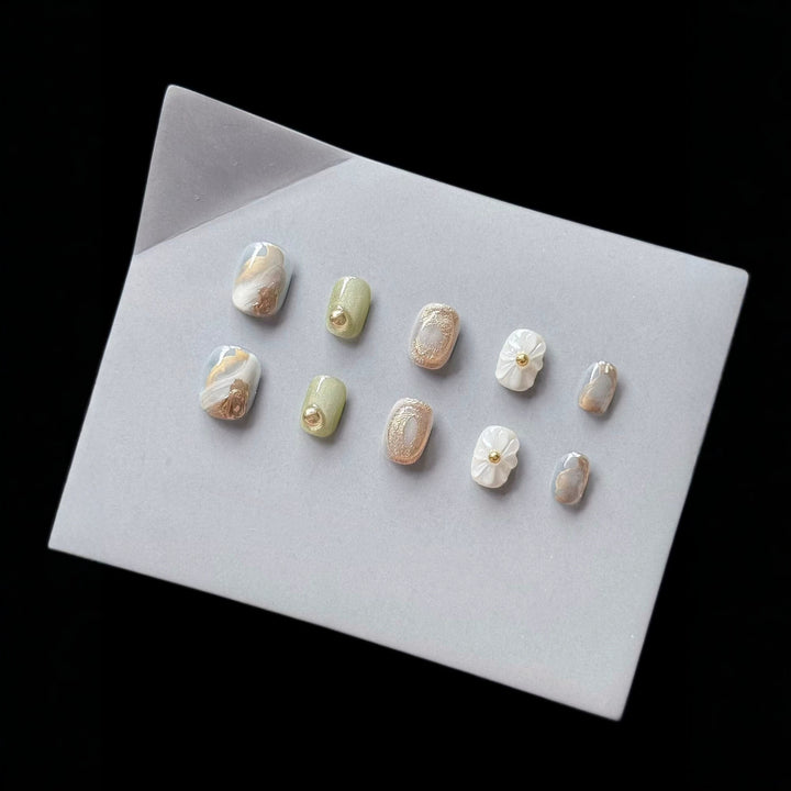 Premium Press-On Nail Art Set with Floral and Metallic Accents