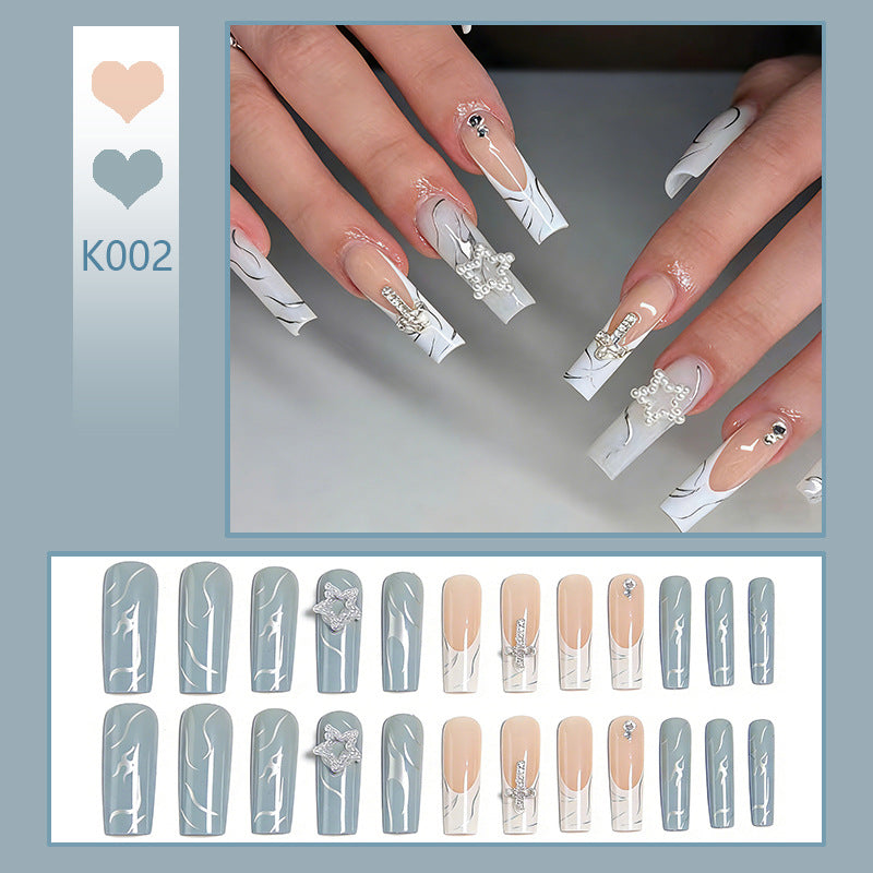 Artificial nails with luxurious marble design and radiant embellishments Stornfield