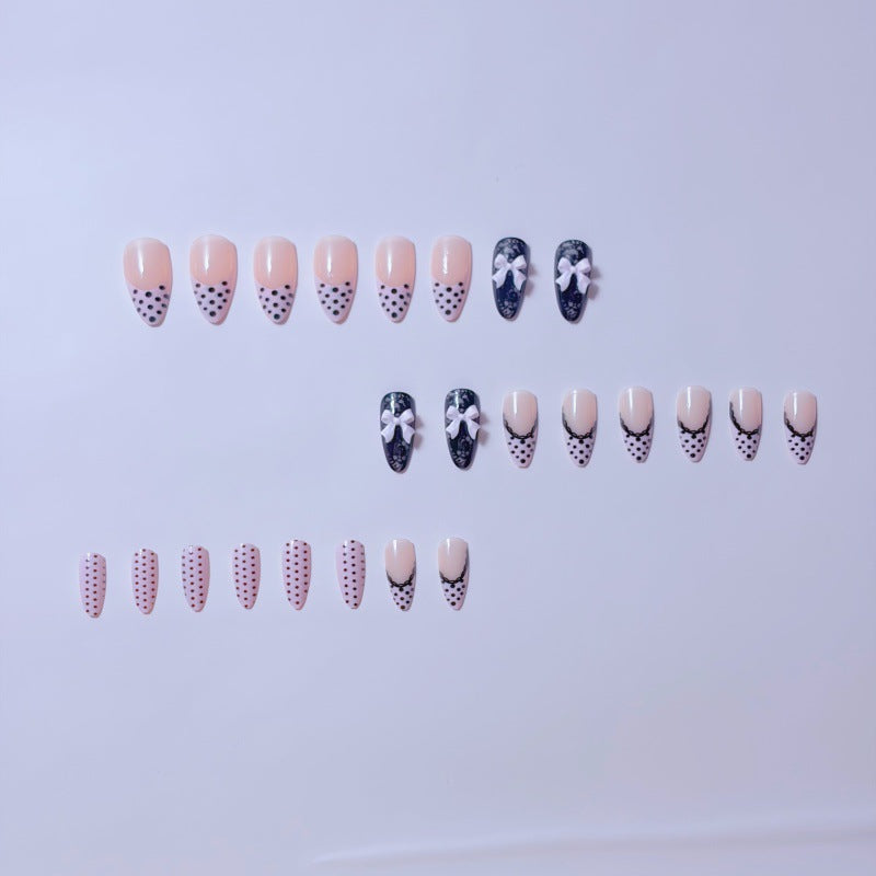 Elegant artificial nails with lace design and bow accents Stornfield