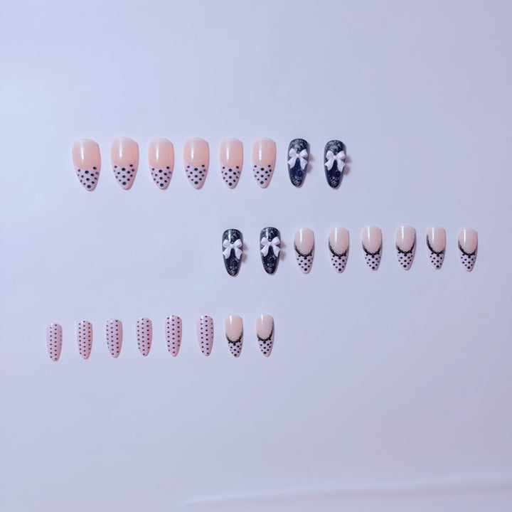 Elegant artificial nails with lace design and bow accents Stornfield