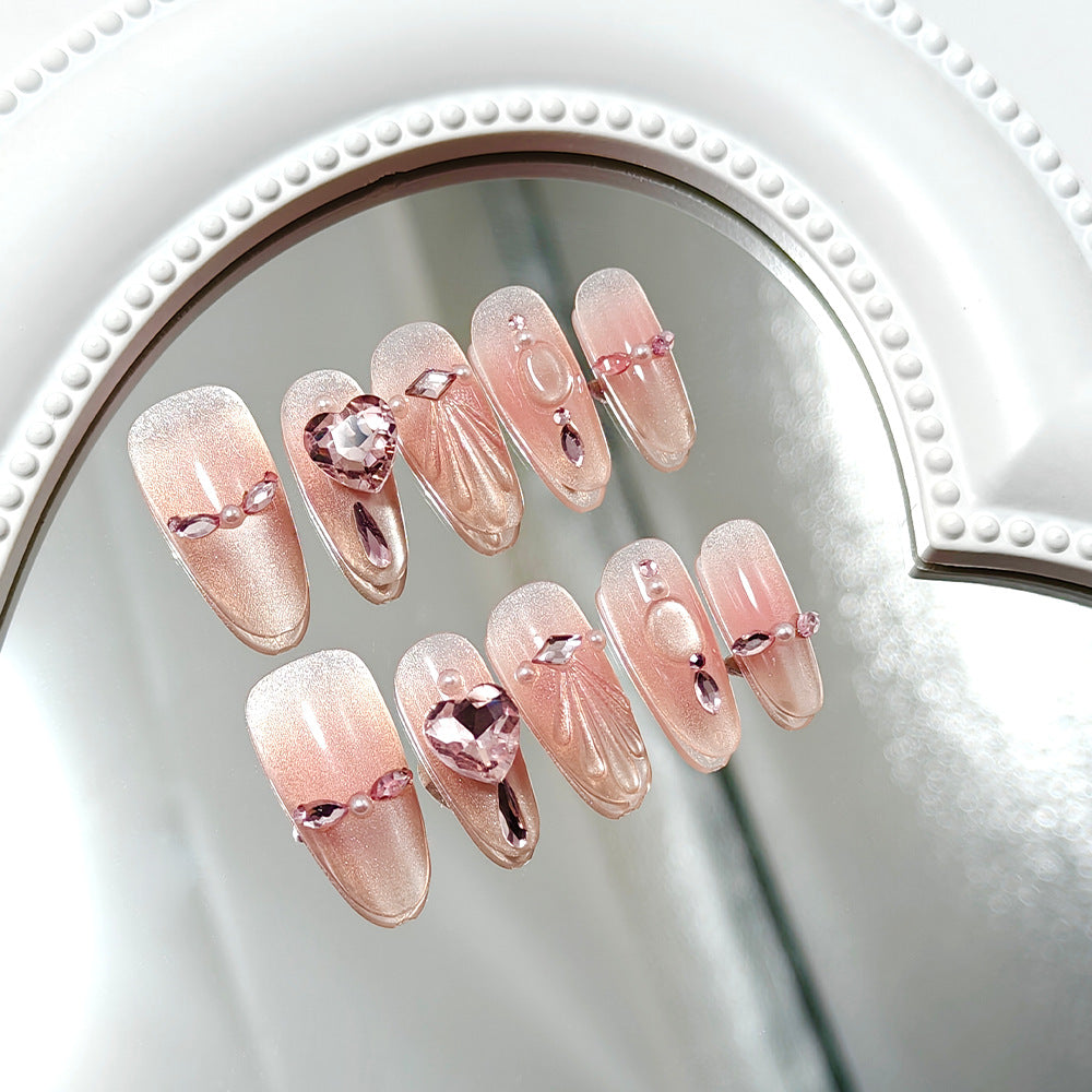 Artificial nails with sparkling heart and rhinestone accents Stornfield