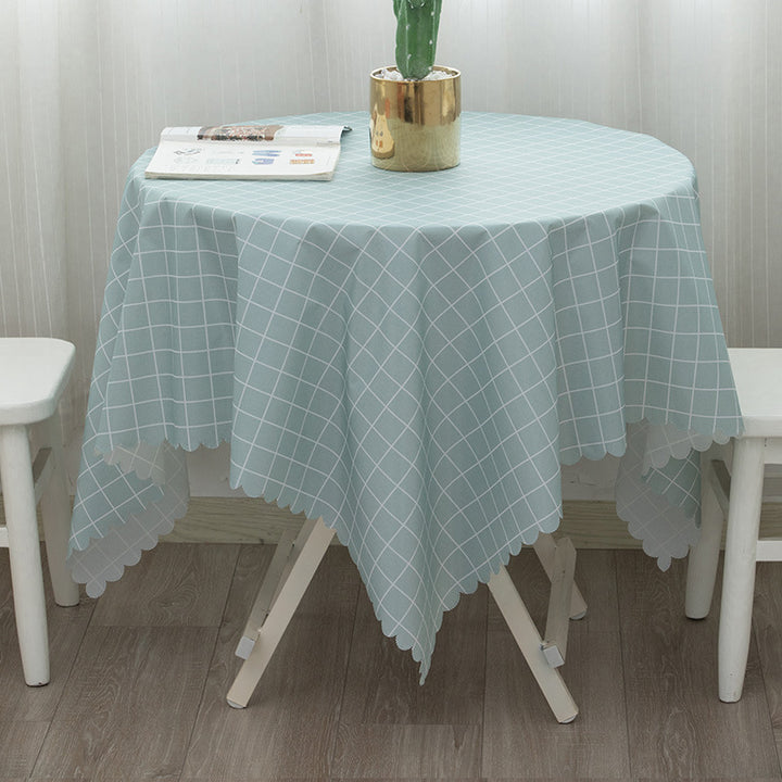Round washable tablecloth with fine checkered grid pattern and wavy hem